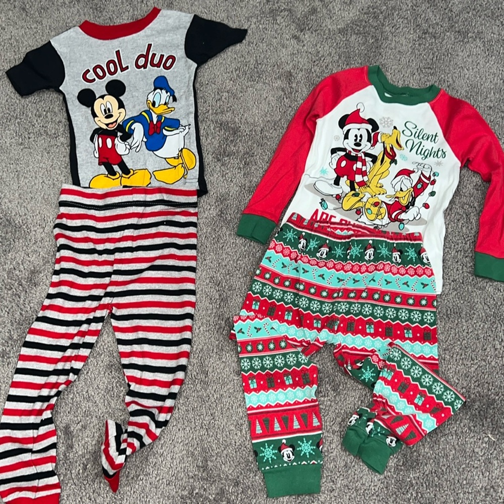 2 pair of Disney PJs- 1 pair of holiday and 1 pair of everyday pjs